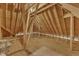 Unfinished attic area showing exposed rafters and plywood flooring at 3803 Bennett Grove Dr, Wake Forest, NC 27587
