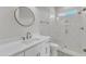 Modern bathroom featuring a glass-enclosed shower, white vanity, and sleek fixtures at 3803 Bennett Grove Dr, Wake Forest, NC 27587