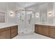 Beautiful bathroom with marble tiling, glass shower, and dual vanities at 3803 Bennett Grove Dr, Wake Forest, NC 27587