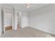 Spacious bedroom with carpet flooring, a ceiling fan, and two closets at 3803 Bennett Grove Dr, Wake Forest, NC 27587
