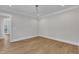 Minimalist bedroom with hardwood floors, neutral walls, and natural light at 3803 Bennett Grove Dr, Wake Forest, NC 27587