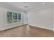 Bright, airy bedroom with hardwood floors and a large window overlooking the yard at 3803 Bennett Grove Dr, Wake Forest, NC 27587