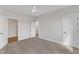 Bedroom featuring two doorways, neutral carpet, and a ceiling fan at 3803 Bennett Grove Dr, Wake Forest, NC 27587