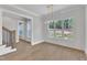 Bright dining room with large windows, shiplap walls, and elegant lighting fixtures at 3803 Bennett Grove Dr, Wake Forest, NC 27587