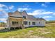 Back of house featuring covered porch, stairs and a deck at 3803 Bennett Grove Dr, Wake Forest, NC 27587
