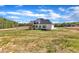 View of house on a large lot surrounded by trees at 3803 Bennett Grove Dr, Wake Forest, NC 27587