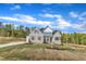 Lovely home with brick and siding accents, shutters, impeccable lawn and professional landscaping at 3803 Bennett Grove Dr, Wake Forest, NC 27587