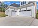 House featuring a three car garage and concrete driveway at 3803 Bennett Grove Dr, Wake Forest, NC 27587