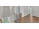 Hallway featuring hardwood floors and black wrought iron railing at 3803 Bennett Grove Dr, Wake Forest, NC 27587