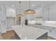 Beautiful kitchen with white cabinets, marble countertops, and stainless steel appliances at 3803 Bennett Grove Dr, Wake Forest, NC 27587