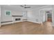 Open living room with wood floors, fireplace, and natural light at 3803 Bennett Grove Dr, Wake Forest, NC 27587