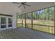 Screened porch with ceiling fan and a view of the backyard at 3803 Bennett Grove Dr, Wake Forest, NC 27587