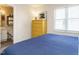 Blue and yellow bedroom with a view of the bathroom at 431 Oak Run Dr, Raleigh, NC 27606
