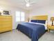 Bedroom with a king-size bed and yellow dresser at 431 Oak Run Dr, Raleigh, NC 27606