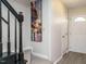 Bright entryway with staircase, art, and neutral color palette at 431 Oak Run Dr, Raleigh, NC 27606