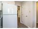 White kitchen with an LG refrigerator and pantry access at 431 Oak Run Dr, Raleigh, NC 27606