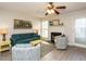 Living room with teal sofa, fireplace, and wood-look flooring at 431 Oak Run Dr, Raleigh, NC 27606