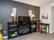 Dedicated media area with flat-screen TV and ample shelving at 431 Oak Run Dr, Raleigh, NC 27606