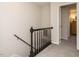 Staircase with black railing leading to the upper level at 431 Oak Run Dr, Raleigh, NC 27606