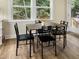 Kitchen dining area with four-chair table and view to backyard at 438 S Hillsborough St, Franklinton, NC 27525