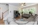 Spacious living room with sectional sofa, fireplace, and large windows at 438 S Hillsborough St, Franklinton, NC 27525