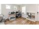 Home office with hardwood floors, desk, and storage at 438 S Hillsborough St, Franklinton, NC 27525