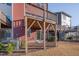 Backyard with elevated wooden deck and partial view of other homes at 445 Brier Summit Pl, Durham, NC 27703