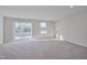 Spacious basement with carpeting, sliding glass doors, and windows at 445 Brier Summit Pl, Durham, NC 27703