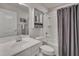Guest bathroom with tub shower combo and gray curtain at 445 Brier Summit Pl, Durham, NC 27703