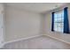 Small bedroom with carpet, window, and neutral walls at 445 Brier Summit Pl, Durham, NC 27703