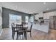 Kitchen and dining area with wood flooring and a modern design at 445 Brier Summit Pl, Durham, NC 27703