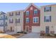 Three-unit townhome building with red, beige, and blue siding at 445 Brier Summit Pl, Durham, NC 27703