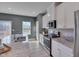 Modern kitchen with white cabinets and granite countertops at 445 Brier Summit Pl, Durham, NC 27703