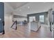 Modern kitchen with white cabinets, granite countertops, and stainless steel appliances at 445 Brier Summit Pl, Durham, NC 27703