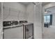 Laundry room with Samsung washer and dryer and additional shelving at 445 Brier Summit Pl, Durham, NC 27703