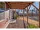 Ground level patio with wooden support beams and access to backyard at 445 Brier Summit Pl, Durham, NC 27703