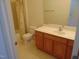 Bathroom features a vanity with wood cabinets, a toilet, and a shower/tub at 4712 Fox Fern Ln, Raleigh, NC 27604
