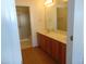 Bathroom boasts double sinks and a large vanity with wood cabinets at 4712 Fox Fern Ln, Raleigh, NC 27604