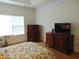 Primary bedroom with large window and ample closet space at 4712 Fox Fern Ln, Raleigh, NC 27604