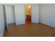 Hardwood floor bedroom with access to a full bathroom at 4712 Fox Fern Ln, Raleigh, NC 27604