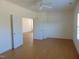 Spacious bedroom with wood floors and neutral walls, offering a calming atmosphere at 4712 Fox Fern Ln, Raleigh, NC 27604