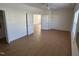 Bedroom featuring hardwood floors, a ceiling fan, and doors leading to other rooms at 4712 Fox Fern Ln, Raleigh, NC 27604