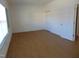 Bright bedroom with wood flooring, neutral walls, and ample closet space at 4712 Fox Fern Ln, Raleigh, NC 27604