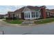Brick ranch home with sunroom and landscaped front yard at 4712 Fox Fern Ln, Raleigh, NC 27604