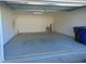 Attached garage with overhead door and ample storage space at 4712 Fox Fern Ln, Raleigh, NC 27604