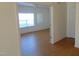 View of an interior hallway with light wood floors and doors leading to other rooms at 4712 Fox Fern Ln, Raleigh, NC 27604