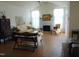 Living room with hardwood floors, fireplace, and vaulted ceiling at 4712 Fox Fern Ln, Raleigh, NC 27604