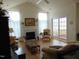 Bright living room with fireplace and access to sunroom at 4712 Fox Fern Ln, Raleigh, NC 27604