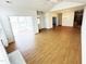 Open-concept living room with vaulted ceiling and views of sunroom at 4712 Fox Fern Ln, Raleigh, NC 27604