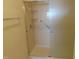 Clean shower with tiled walls and a built-in seat at 4712 Fox Fern Ln, Raleigh, NC 27604